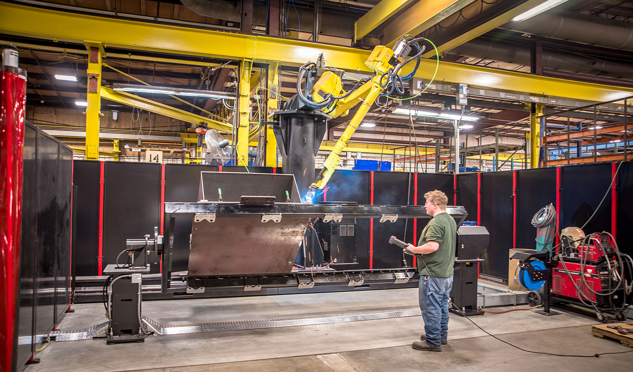 Jones Metal Inc robotic weld employee programs and runs the BIGBOT robotic weld system